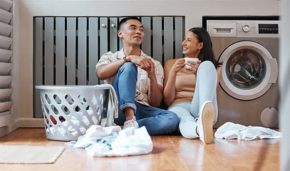 Image showing Couple, chores and laundry while doing home cleaning and feeling happy while talking and relaxing together. Boyfriend and girlfriend with healthy communication while sitting together on wash day