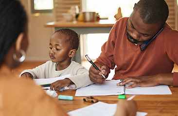 Image showing Busy and multitasking father talking on a call while taking care of his child at home. African american entrepreneur or freelancer analyzing paperwork with his wife caring for his busy little son