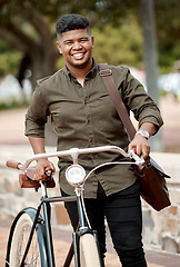Image showing Happy business man riding a bicycle, commuting and staying active while traveling in city. Portrait of a smiling, cheerful and positive guy cycling on a bike and being carbon neutral at a park
