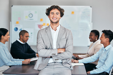 Image showing Business man standing with arms crossed in meeting, leading a training workshop and looking proud with colleagues at work. Portrait of a smiling expert manager showing leadership in a seminar