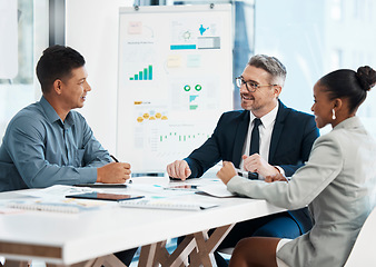 Image showing Business meeting, planning and teamwork while sharing idea for financial growth and innovation by marketing team discussing graphs and data in boardroom. Diverse colleagues sharing vision and mission