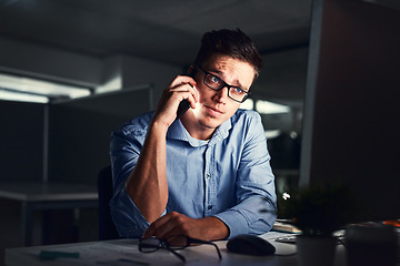 Image showing Stressed, overworked and worried while talking on phone to solve problem while working late night at the office. Serious and exhausted man calling IT about computer issue trying to reach deadline