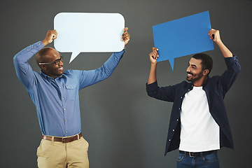 Image showing Men holding speech bubbles for social media communication via messaging, chatting and texting. Team of happy, smiling and excited marketing professionals showing networking through online platforms