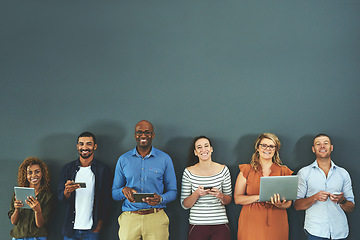 Image showing Many diverse business people working with technology devices, digital marketing, collaborating online on grey copy space. Group connecting to global networking, advertising social community and unity