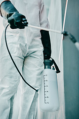 Image showing Covid pandemic outbreak cleaner and healthcare worker in protective ppe to prevent spread of virus outside. Professional in hazmat suit cleaning and disinfecting the street or building for hygiene