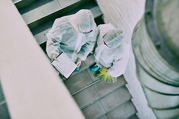 Image showing Medical team and covid hygiene healthcare professionals wearing hazmat suits for safety while working at quarantine site. Above first responders in protective gear to fight virus with innovation