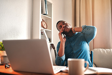 Image showing Tired business man with neck pain on a laptop and phone call, looking stressed and stretching bad, strained muscle or sore back. Stressed, multitasking guy having a difficult time working from home