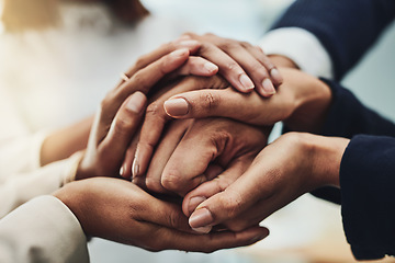 Image showing Business people holding hands for support, motivation and comfort together at work. Closeup of group of professional employees, colleagues and workers joining hands for help, consoling and community