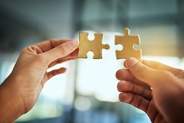 Image showing Puzzle, teamwork and innovation while people fit jigsaw pieces together in an office. Business solution, strategy and success while plans come together. Connection, partnership and building trust