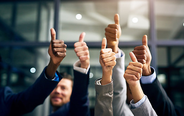 Image showing Thumbs up with hands of a business team or group giving their approval, saying thank you or giving motivation together in their office at work. Corporate professionals supporting with trust