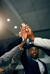 Image showing High five, teamwork and working together with a team or group of colleagues standing together in their corporate office. Motivation, success and achievement through unity, solidarity and trust
