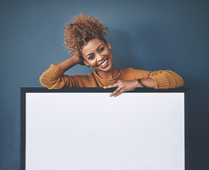 Image showing Woman showing blank poster, copy space board and placard sign to promote, market and advertise opinion or voice on voting democracy. Portrait of smiling, young and happy lady endorsing with billboard