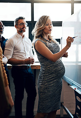 Image showing Pregnant businesswoman doing a presentation in a meeting planning the company growth strategy in an office. Serious female entrepreneur briefing her team on the startup project mission and vision