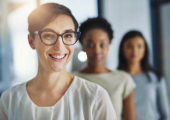 Image showing Smiling and happy modern business woman looking proud of her success and team. Portrait of a female office worker with a smile enjoying her job. Successful colleague ready for a work collaboration