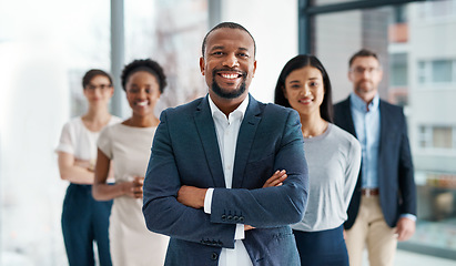 Image showing Professional, diverse and successful business team smiling and standing together in an office. Happy, formal and multiracial corporate staff, bank workers or businesspeople looking at camera.