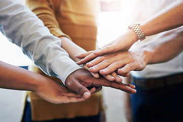 Image showing Teamwork, unity and collaboration by hands joining in support of a mission, goal or vision. Diverse colleagues stacking during team building, showing trust, community and global power together