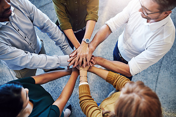 Image showing Teamwork, hands in a huddle and working together with a team or group of business people and colleagues standing in the office. Togetherness, unity and motivation between creative coworkers at work