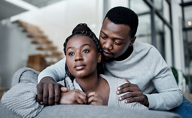 Image showing Unhappy, sad and depressed couple while boyfriend comfort, support and hug partner while struggling, mourning loss or depression problem at home. Asking forgiveness after argument about cheating