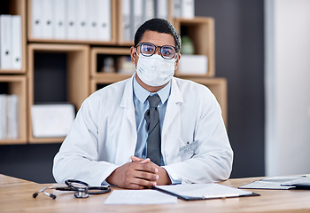 Image showing Doctor wearing covid mask in clinic to prevent spread of pandemic virus, disease or illness in hospital consult. Portrait of medical professional, healthcare oe frontline worker ready to treat people