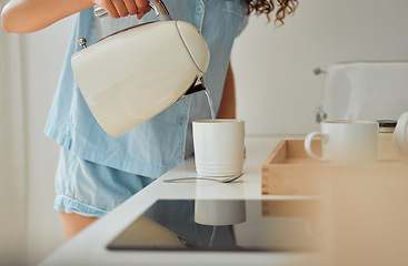 Image showing Morning, breakfast coffee and female hands pouring water in cup from retro kettle in kitchen at home. Woman in pajamas brewing tea or making a beverage on counter to start the day.