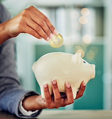 Image showing . Savings, investment or a woman putting a coin into a piggybank for financial growth and freedom. Closeup of a female investing in her future or retirement fund for insurance and budget security.