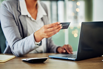 Image showing Digital banking, online shopping or internet business planning of a woman holding a credit card. A female accountant at a office computer checking finance data and working with financial information