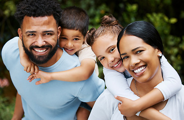 Image showing Happy, smiling and loving family bonding enjoying fun moments together in the outdoors. Portrait of playful, joyful and caring parents having quality time and giving kids a piggyback ride in nature