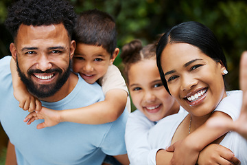 Image showing Happy, smiling and loving family taking a selfie enjoying fun moments together in the outdoors. Playful, joyful and caring couple having quality time with their kids on a holiday outside in nature.