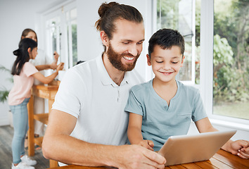 Image showing Learning with tablet, watching educational videos and searching the internet with father and son relaxing together at home. Smiling, curious and happy boy browsing the web and having fun with parent