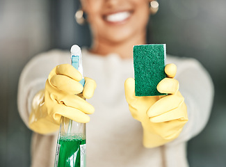 Image showing Cleaning, hygiene and sanitation with a spray bottle and sponge in the hands of a woman wearing gloves. Closeup of chores, housework and a spring clean to keep things neat, tidy and fresh