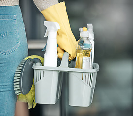 Image showing Domestic worker, maid or cleaner hands holding or carrying cleaning products and equipment or supplies. For home hygiene, contact us for a handy helper agency or professional household service.