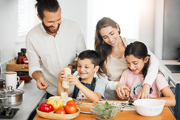 Image showing Healthy food, cooking and bonding of family making, preparing and cutting ingredients for meal together in a home kitchen. Happy parents teaching fun kids about fresh, homemade and nutritious eating