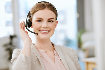 Image showing Smiling, friendly call center agent with headset for online consulting in an IT tech agency. Face of female support professional offering virtual assistance to web user or contact us hotline at work.
