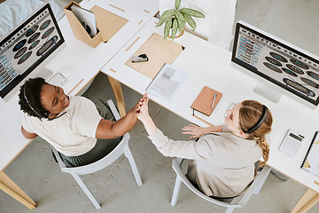 Image showing Teamwork, call center and high five between colleagues while celebrating a sale, reaching target or success at desks from above. Telemarketing agents or operators offering support and good service