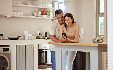 Image showing Happy, loving and texting couple on phone and streaming the internet or social media while bonding at home. Boyfriend and girlfriend showing love and affection while watching together online