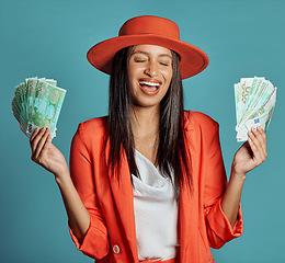 Image showing Money, currency and winning the lottery with a young woman holding cash and looking happy, excited and celebrating success. Female cheering with income, savings or a return on investment in her hands