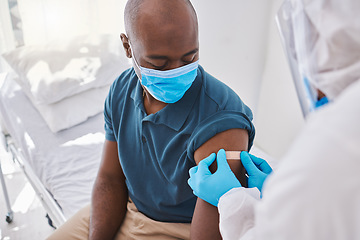 Image showing Man getting covid vaccine, plaster for protection and control of virus with a medical doctor at hospital. Expert, professional or healthcare worker helping patient, doing checkup and giving injection