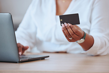 Image showing Credit card, laptop and finance with a businesswoman paying her bills and mortgage online. Black woman ordering, hands and banking as she saves money in her bank account for a budget or loan.