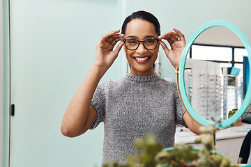 Image showing Woman wearing pair of trendy glasses, stylish spectacles and new prescription lenses at an optometrist. Portrait of a customer choosing, buying and shopping for frames for better vision and eyesight