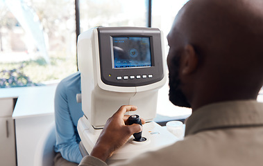 Image showing Eye exam by a doctor looking and checking the vision of a patient at a sight specialist office. Medical healthcare screen technology helping an optometrist see retina health and wellness