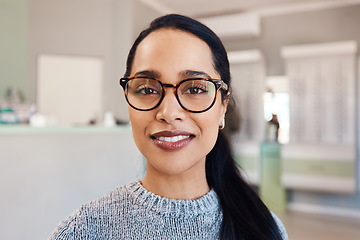 Image showing New glasses at optometrist checkup, buying eyewear and fitting frames at a shop. Closeup portrait of the face of female doing eyecare, examining eyesight and standing at optician consultation