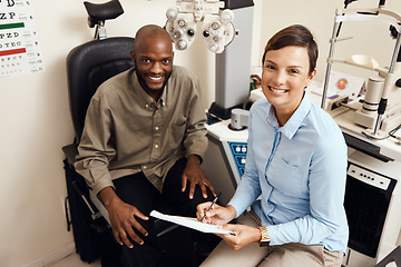 Image showing Optometrist, doctor and vision specialist doing eye test on patient in a clinic. Portrait of happy, smiling and friendly practitioner writing notes while giving good service for optical prescription