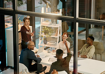 Image showing Businesspeople in a marketing growth strategy discussion in a collaboration meeting using teamwork inside a modern office. Mindset development and team building by diverse, smart and creative adults