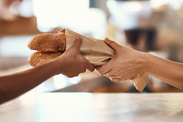 Image showing Customer buying bread from bakery, purchasing baked goods and shopping for food at a shop. Hands of female client and employee giving service, taking product and helping with item at grocery store