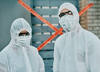 Image showing Covid, coronavirus and outbreak healthcare workers inspecting contamination on site with red tape, protective masks and suits. Portrait of medical team working together to fight a contagious disease