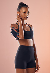 Image showing A listening to music, fit and healthy slim woman living a active, wellness and body or weight watching lifestyle. Fitness, training and sports lover ready for workout routine with athletic sportswear