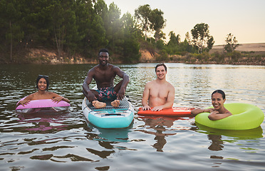 Image showing Friends swimming, relax and enjoy fun summer vacation, holiday or trip to a lake portrait. Young, diverse and traveling men and woman on a youth, camp and adventure lifestyle retreat