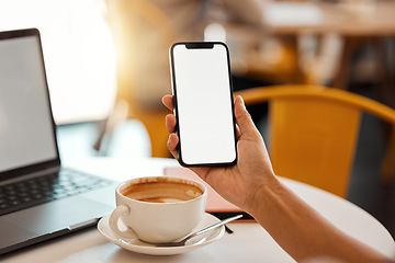 Image showing Closeup of a female hand holding phone with copy space while sitting in a modern coffee shop. Woman working on technology browsing on the internet, social media or an online website at a cafeteria.