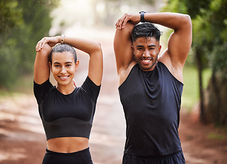 Image showing Fit couple or active, athlete friends stretching arms for exercise warmup outdoors in forest. Workout partners or smiling joggers about to run or do cardio training for health and wellness lifestyle.