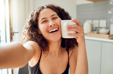 Image showing Happy, morning coffee and selfie while smiling and holding cup against her face for warmth while sitting at home. Portrait of a cheerful young woman enjoying her free time and a hot beverage